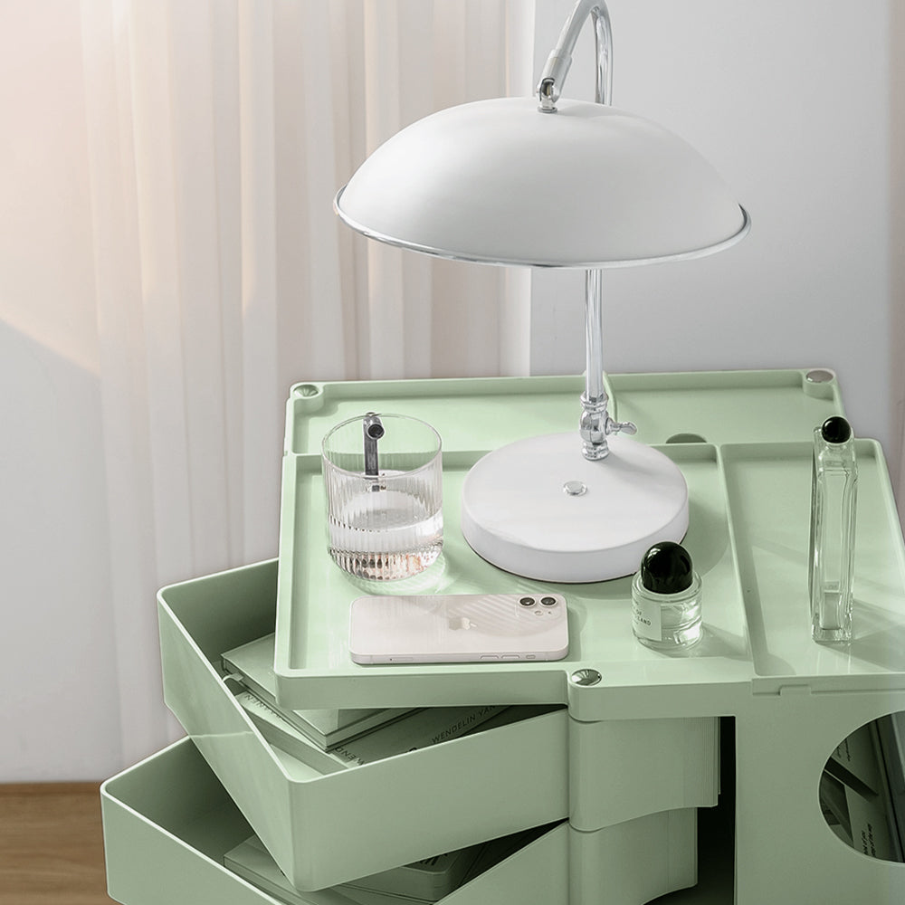 5 Tier Bedside Table Organizer Green with multiple compartments holding lamp, glass, phone, and small bottles in bedroom setting