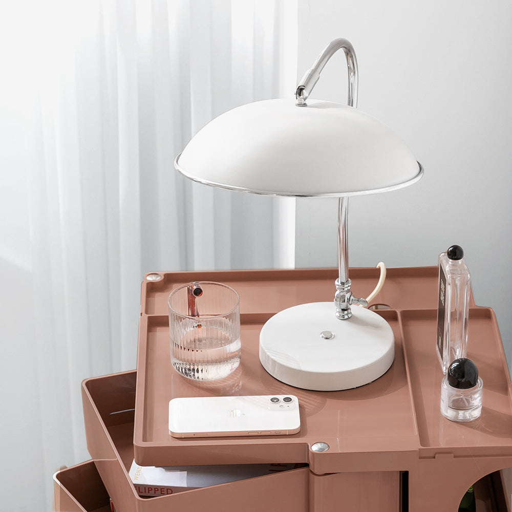 5 Tier Bedside Table Organizer Pink with top tray holding white lamp, glass of water, and smartphone, bedroom furniture accessory