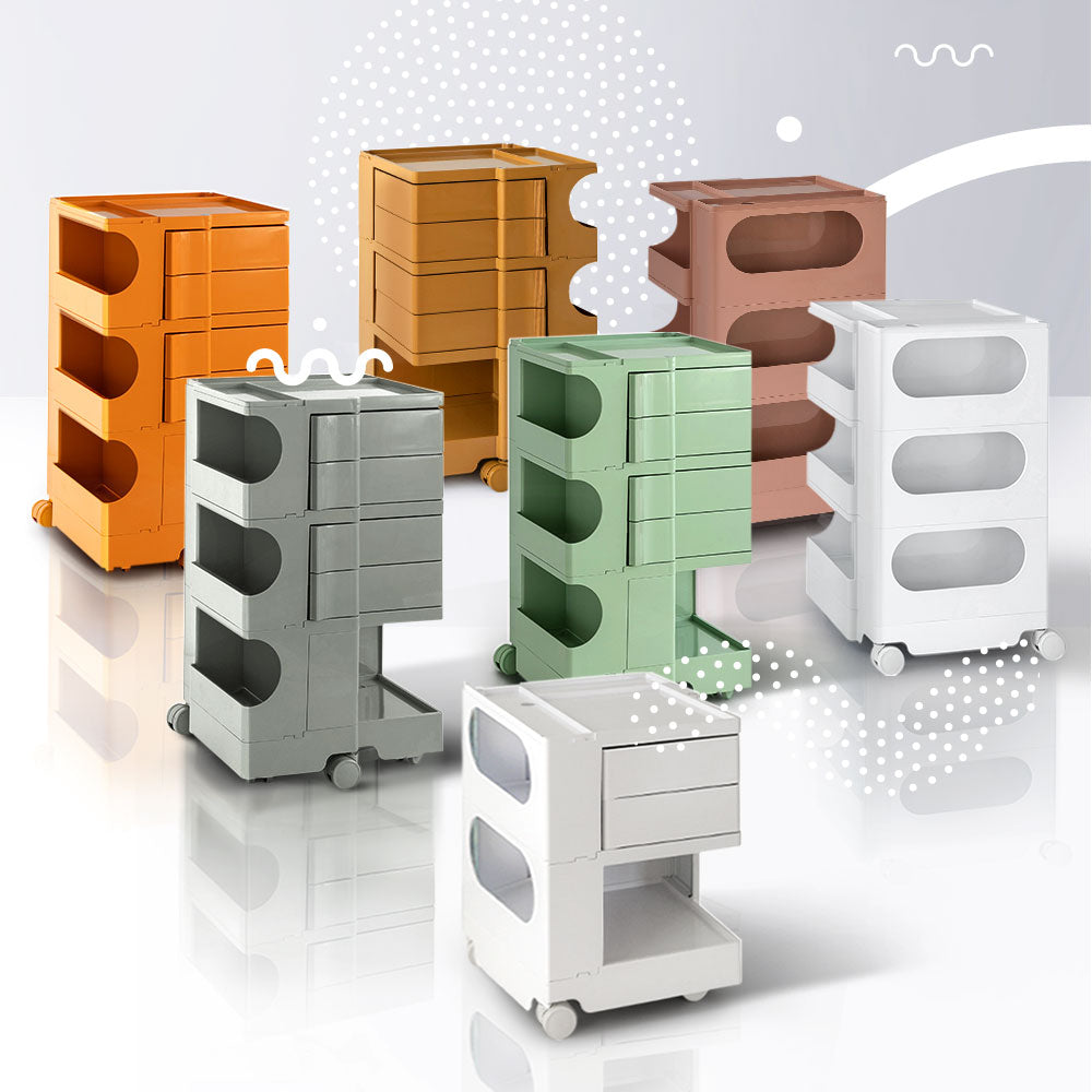 Group of colorful 5 Tier Bedside Table Organizer Pink models with wheels, shown on reflective surface and abstract background
