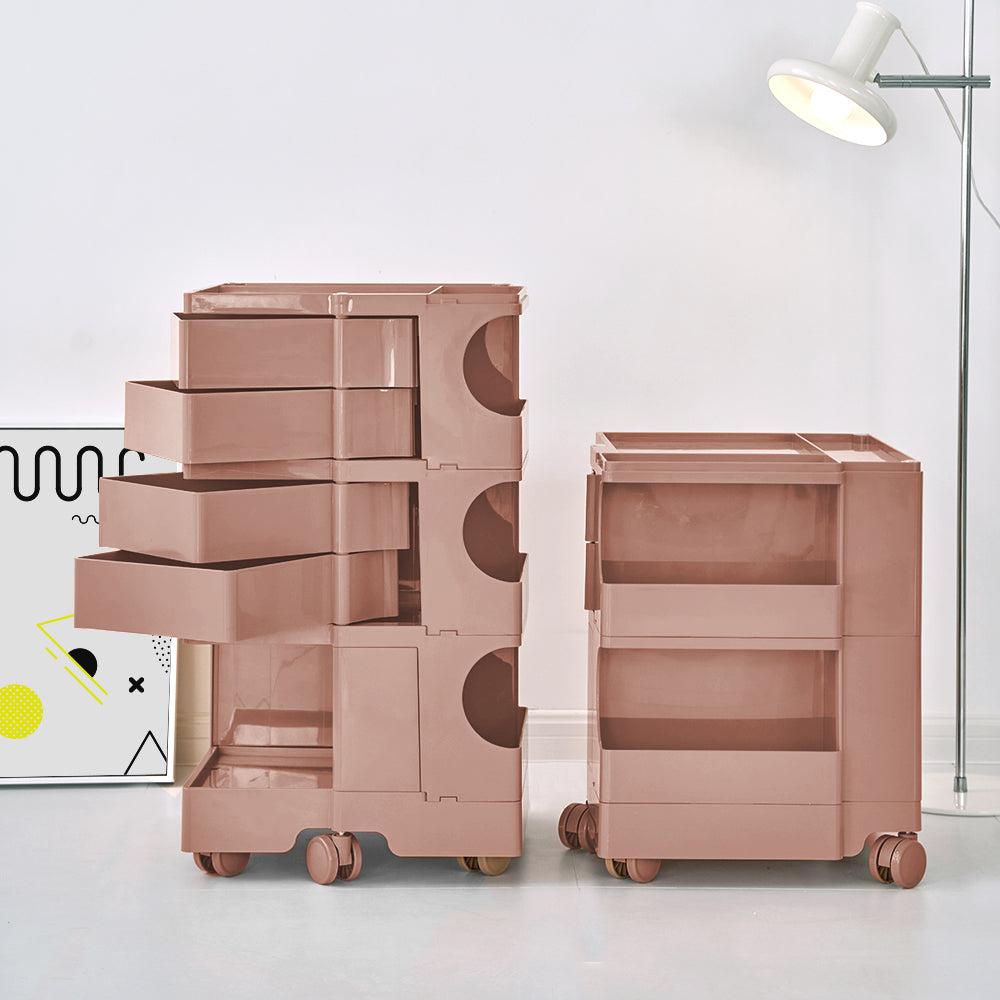 5 Tier Bedside Table Organizer Pink with multiple drawers and compartments on wheels, shown in modern bedroom setting
