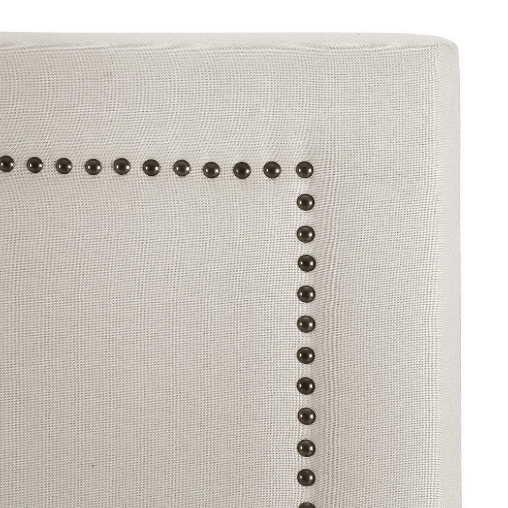 Rive King Size Headboard - Beige with fabric upholstery and decorative metal stud detailing on corner edge