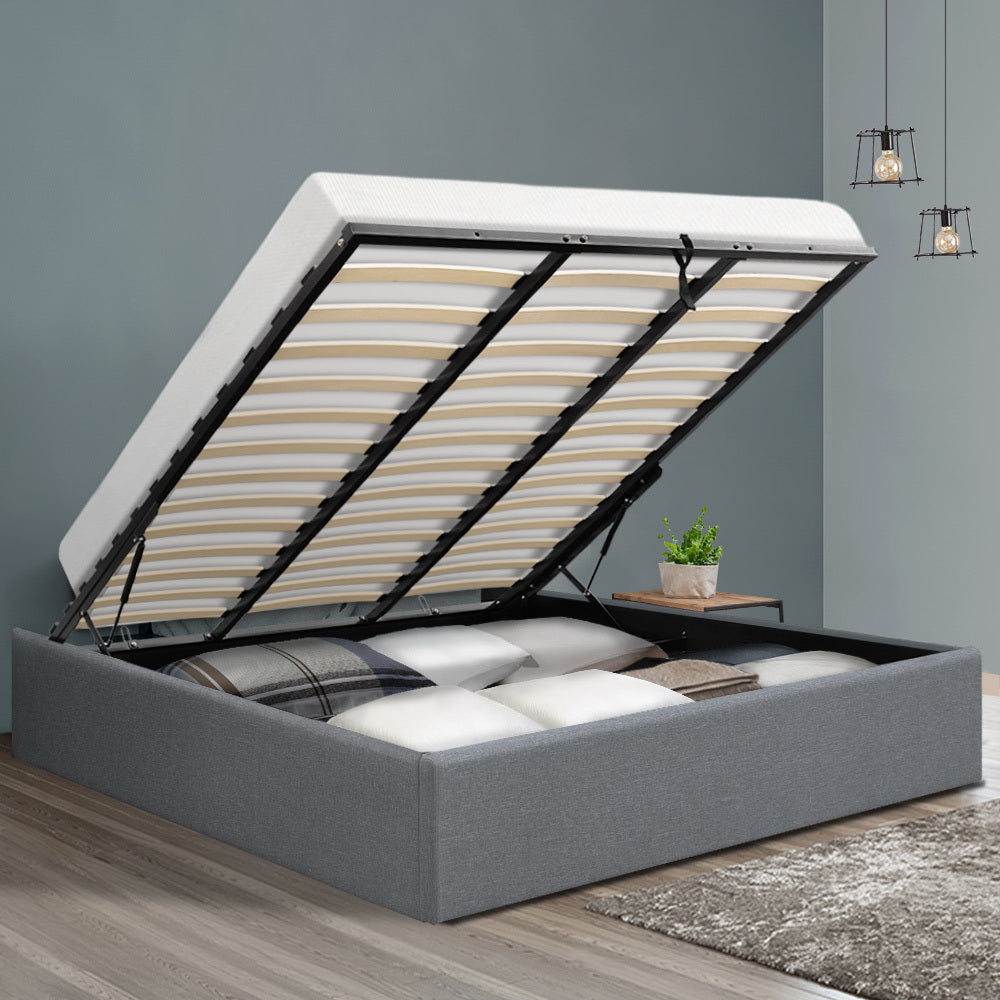 King Size Gas Lift Bed Frame Base with Storage - Grey upholstered frame with lifted slats showing spacious underbed storage compartment