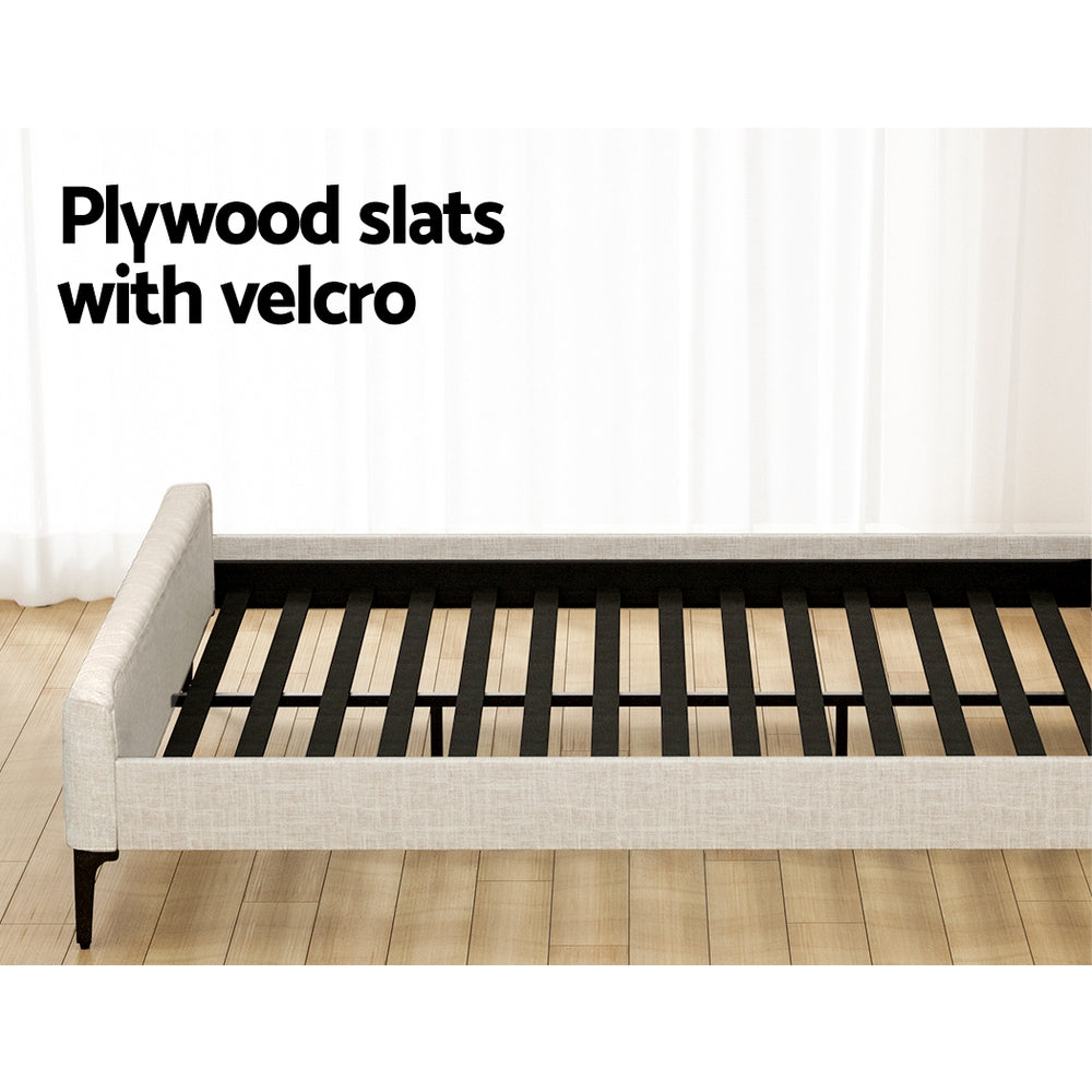 Burleigh King Bed Frame Beige showing plywood slats with velcro and beige upholstered frame on wooden floor