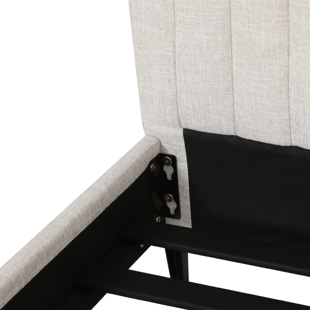Close-up of Burleigh Queen Bed Frame Beige corner joint with beige faux linen upholstery and metal frame components