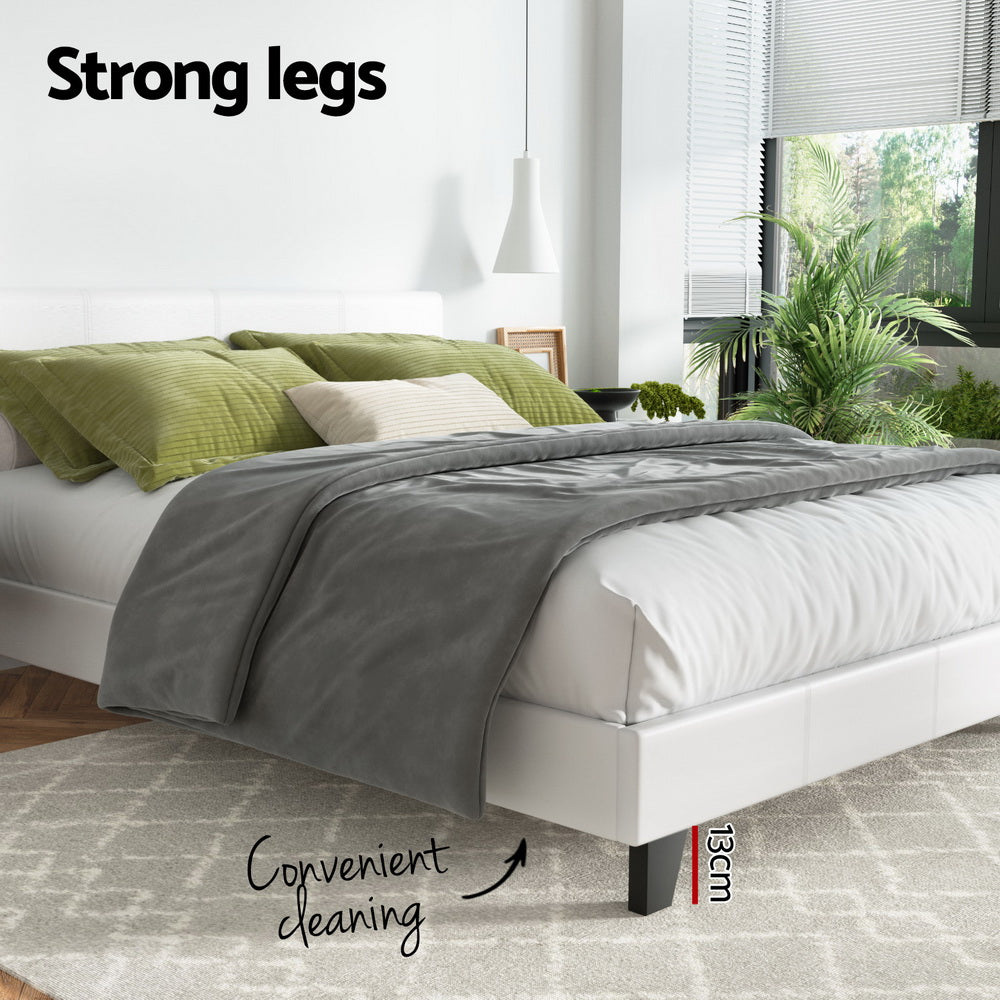 Coogee Queen Bed Frame White with strong legs providing 13cm clearance for convenient cleaning in a modern bedroom setting