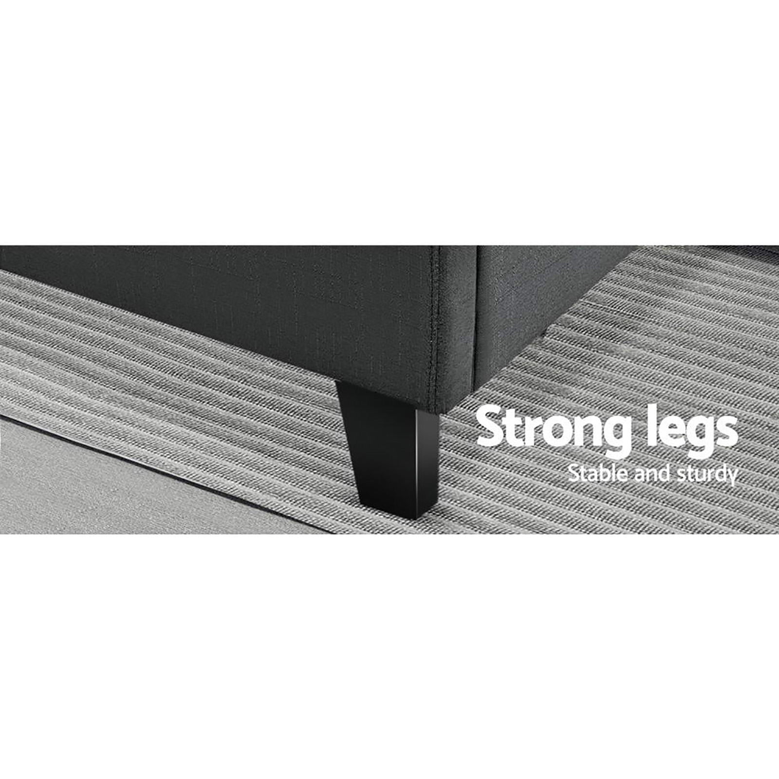Close-up of Bondi Double Bed Frame Charcoal showing sturdy black wooden leg on textured gray rug.