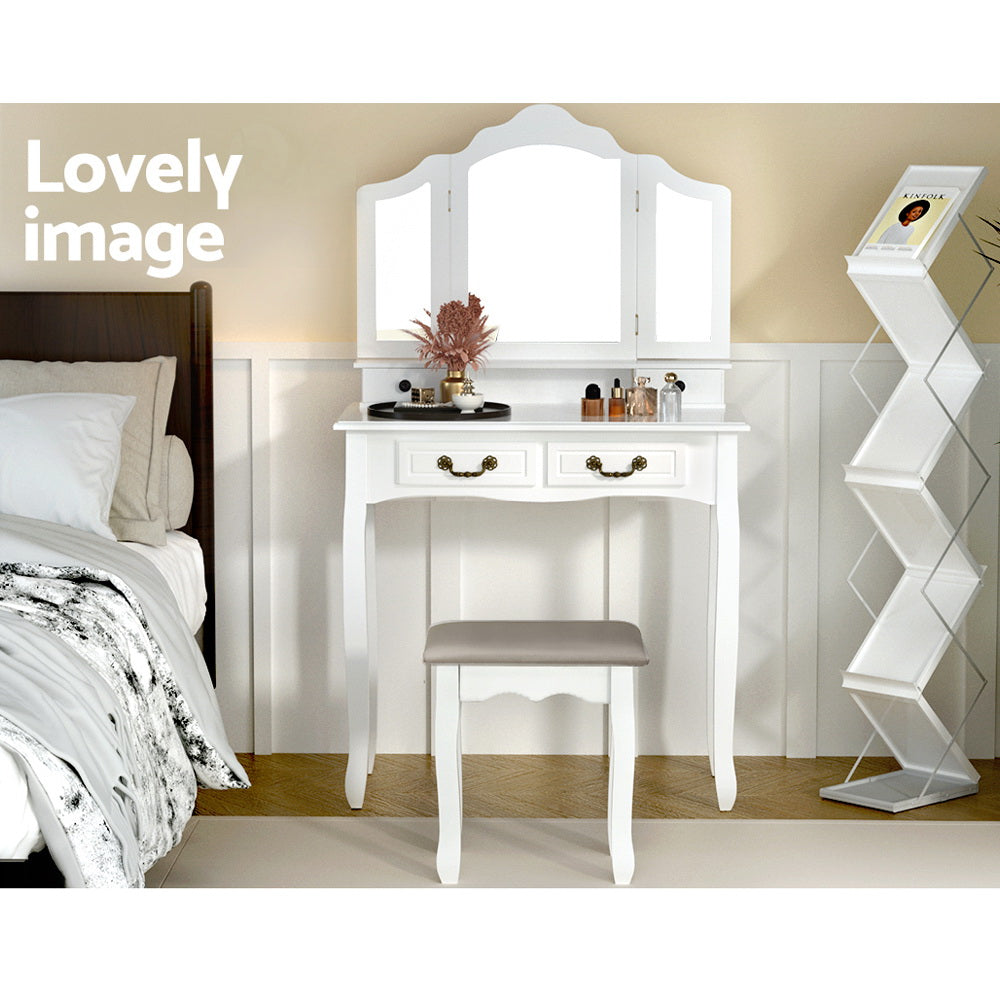 Dressing Table with Mirror - White featuring curved legs, two drawers, and a matching cushioned stool in a bedroom setting