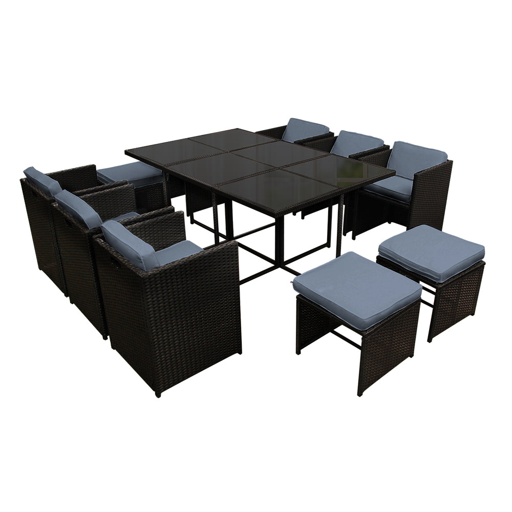 Outdoor Dining Set 11 Piece Wicker Table Chairs Setting Black with cushioned seats and glass-top table on black background