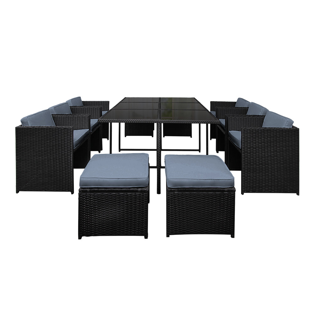 Outdoor Dining Set 11 Piece Wicker Table Chairs Setting Black with gray cushions and glass-top table on white background