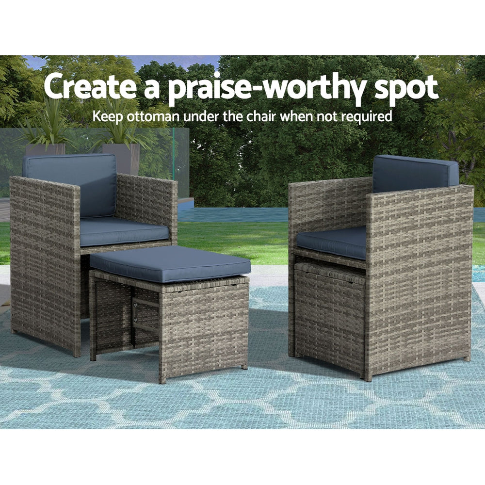 Outdoor Dining Set 11 Piece Wicker Table Chairs Setting Grey featuring two wicker chairs with blue cushions and matching ottoman on patterned rug