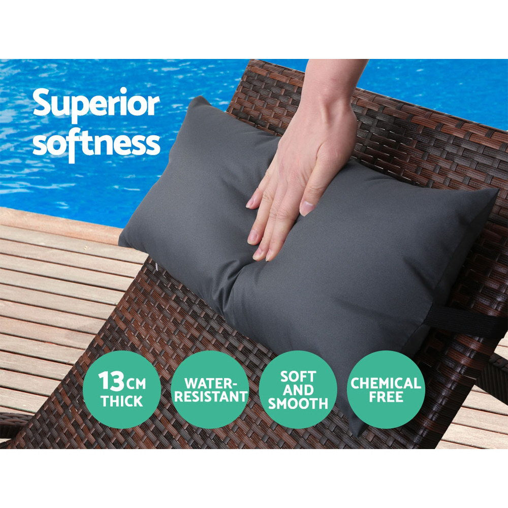 Set of 2 Bianca Outdoor Sun Lounger Chairs with Pillow Headrests - Brown showing soft black pillows on woven frame by poolside