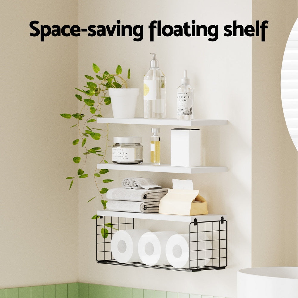 Floating Wall Shelf Set of 3 White with metal basket, displaying toiletries, towels, and green plant in bathroom corner