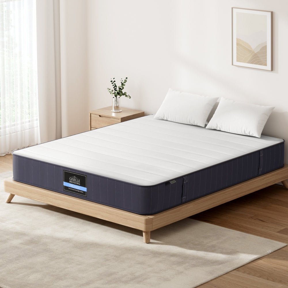 20cm Mattress Queen Bed Pocket Spring Mattresses with breathable knitted fabric on wooden bed frame in bright bedroom setting
