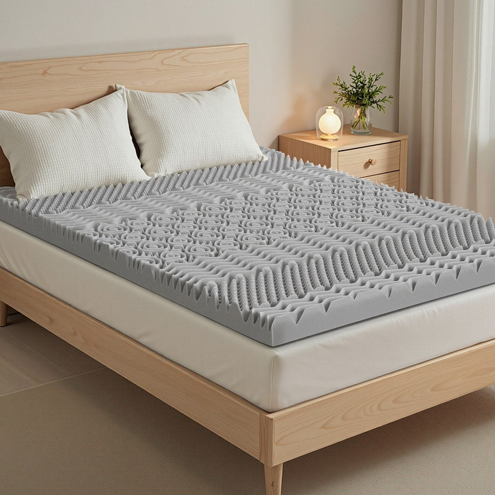 8cm Memory Foam Mattress Topper 7-Zone Graphite Queen on wooden bed frame in bright, modern bedroom setting