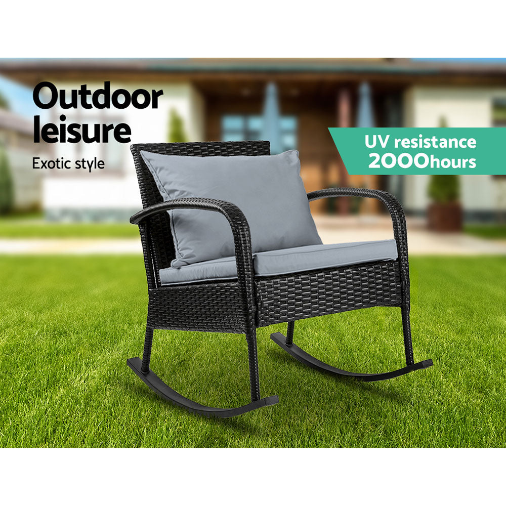 Outdoor Furniture Rocking Chair Wicker Garden Patio Lounge Setting Black with gray cushions on green grass outdoors