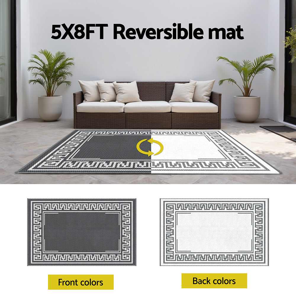 Outdoor Rugs 152x244cm Large Carpet Reversible Area Mat PP Dual-Sided Patio Rug Greek Key shown in white and gray sides outdoors with sofa and plants