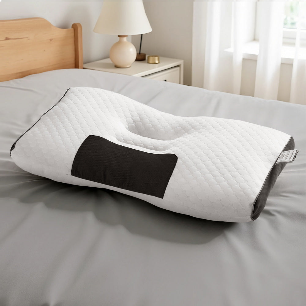 Contour Pillow Ergonomic Neck Pillow 48X73CM with white quilted cover and black accent on gray bed in bedroom setting