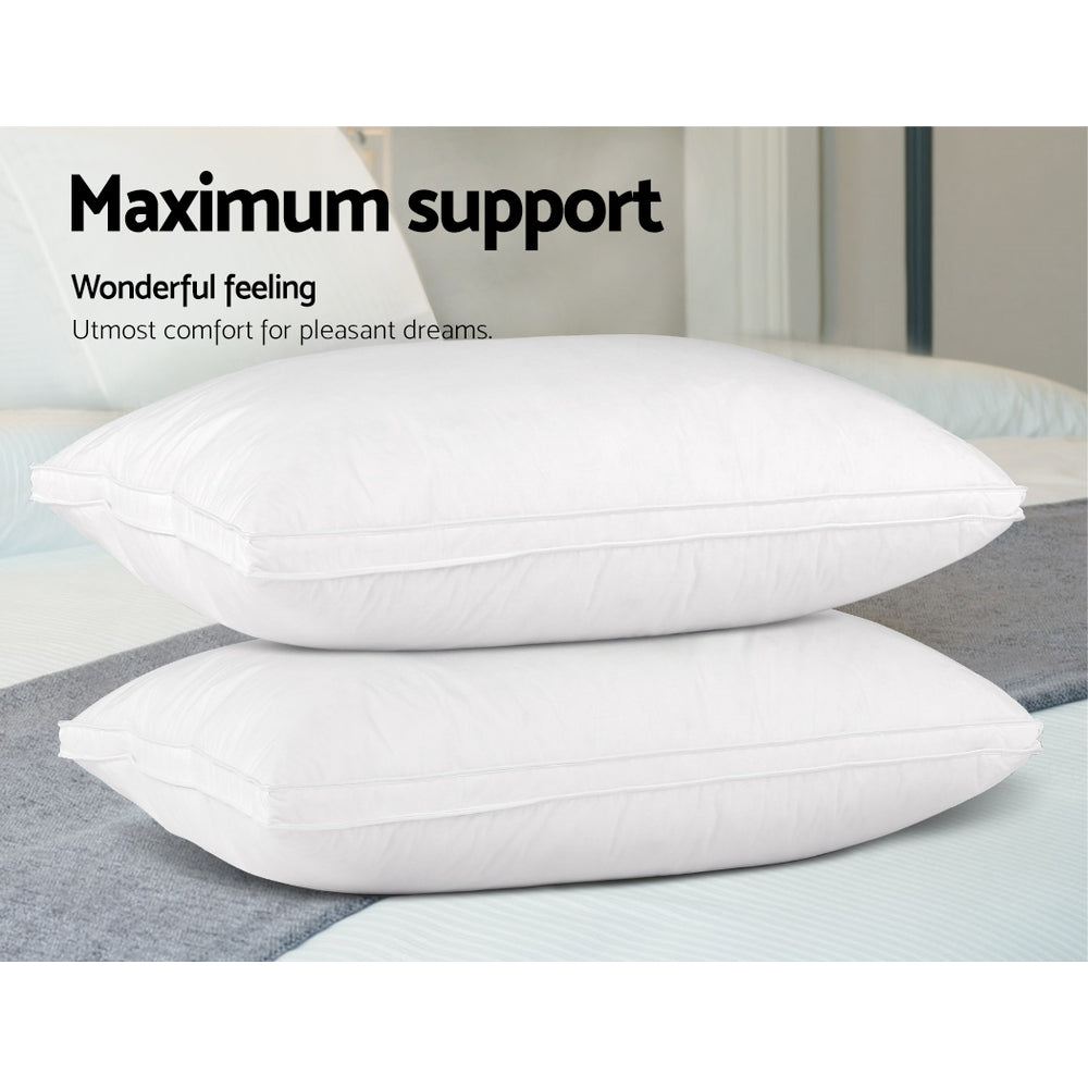 Duck Feather Down Twin Pack Pillow stacked on bed with white pillowcases highlighting maximum support and comfort