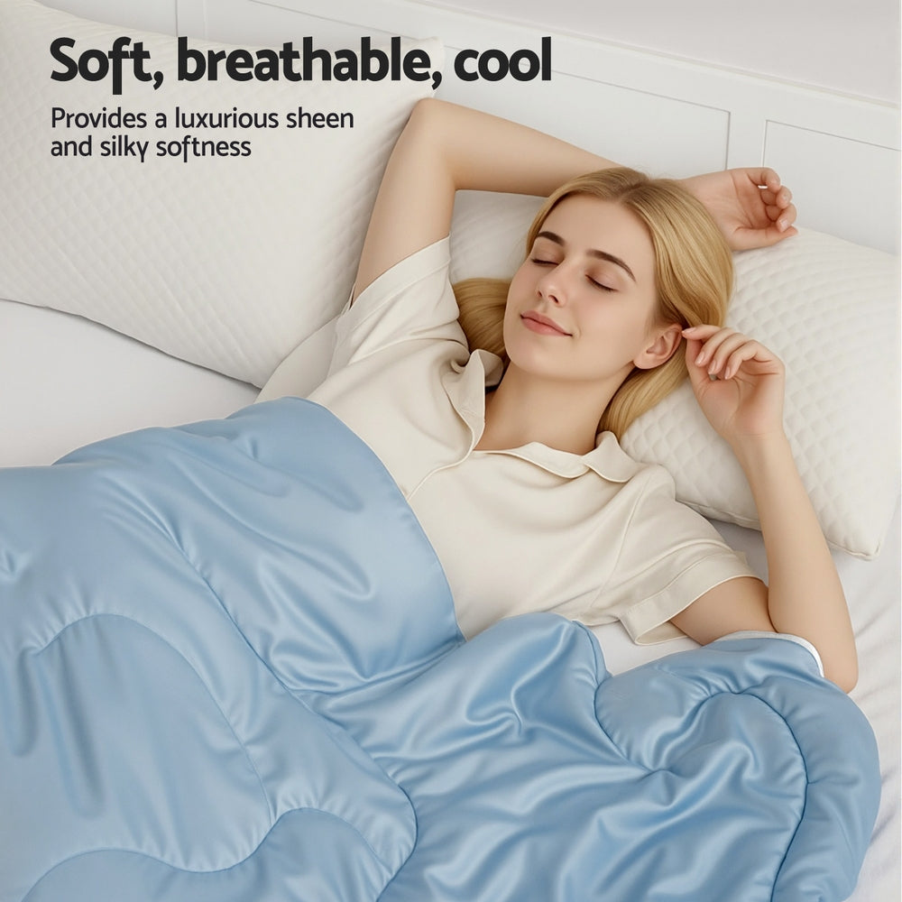 Woman lying in bed under a blue Tencel Quilt 200GSM Summer Quilts Comforter Doona Light Weight Soft Throw Blanket Double