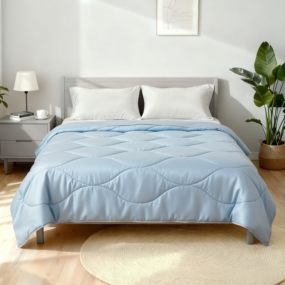 Tencel Quilt 200GSM Summer Quilts Comforter Doona Light Weight Soft Throw Blanket King in light blue on gray bed with white pillows and nightstand