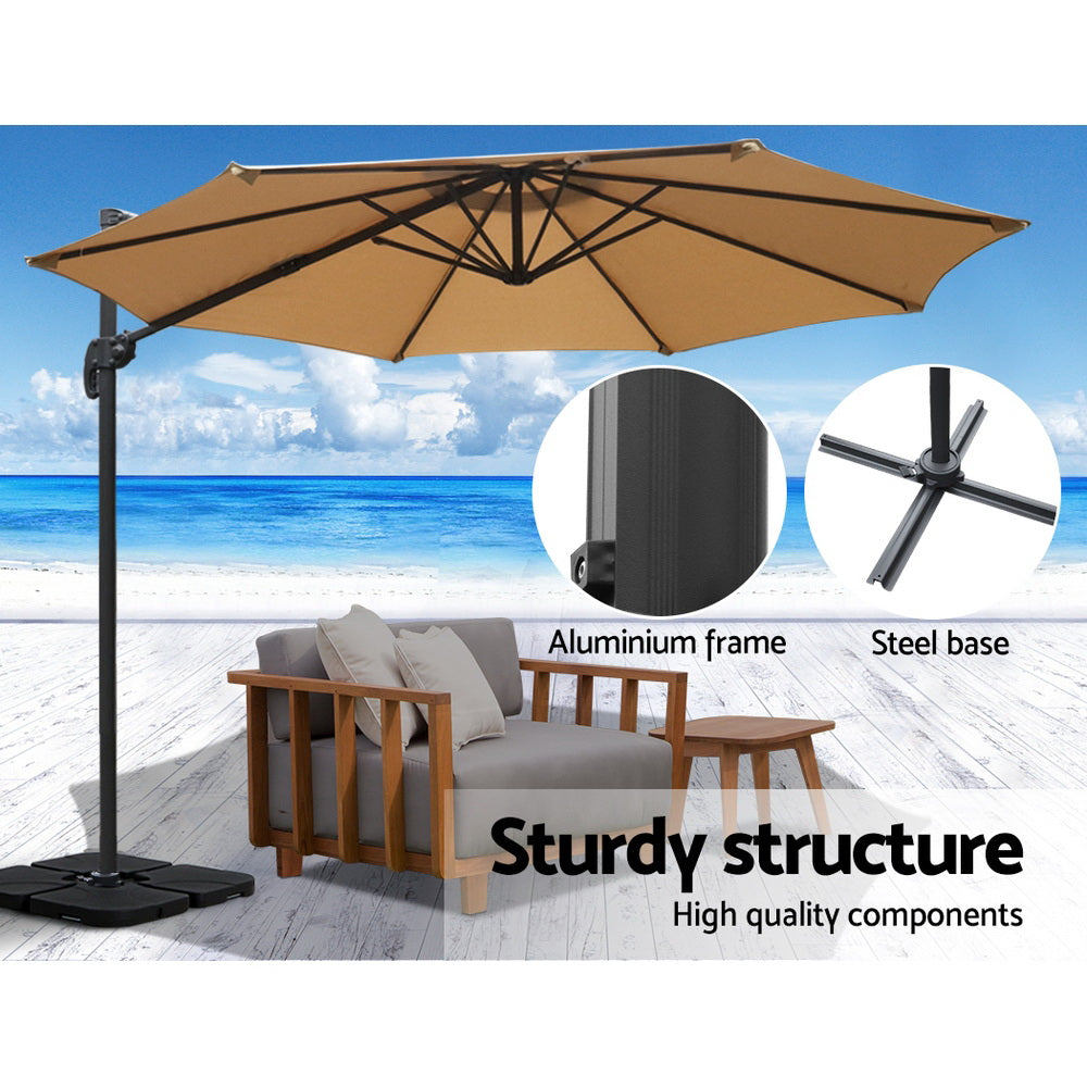 3m Outdoor Umbrella w/Base Cantilever Beach Roma 360 Degree Tilt Beige with aluminium frame and steel base on beach setting