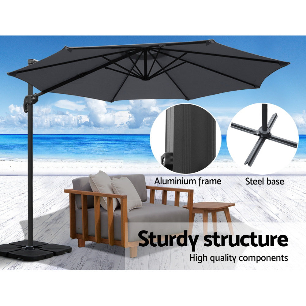 3m Outdoor Umbrella w/Base Cantilever Beach Roma 360 Degree Tilt Charcoal with aluminium frame and steel base on beach setting