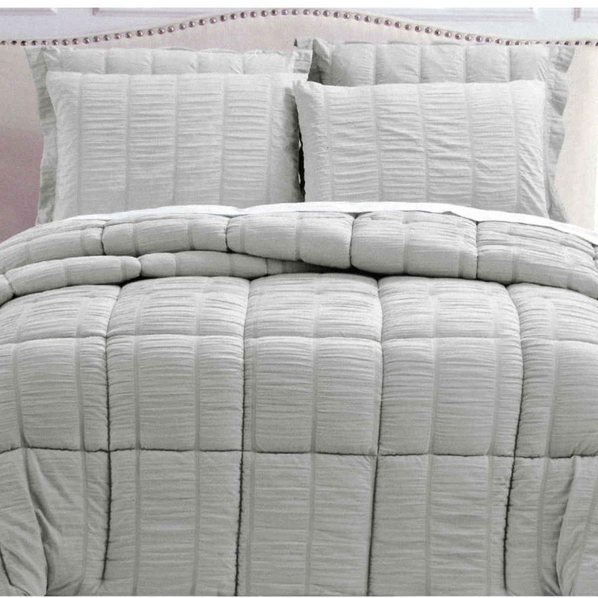 Hotel Living Seersucker Comforter Set Queen Grey with textured design, plush fabric, and matching pillow shams on bed.