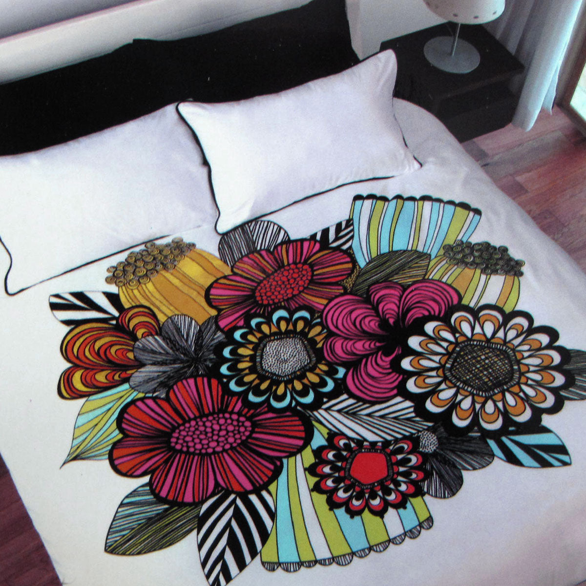 Bold Colorful Quilt Cover Set Single with vibrant floral pattern on white bedding displayed on bed in bedroom setting