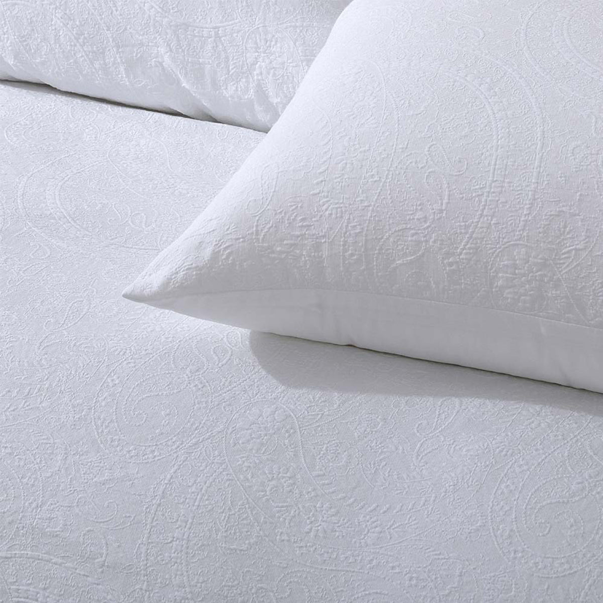 Elma White Jacquard Quilt Cover Set Queen with subtle textured pattern, shown with matching pillowcase on white bedding