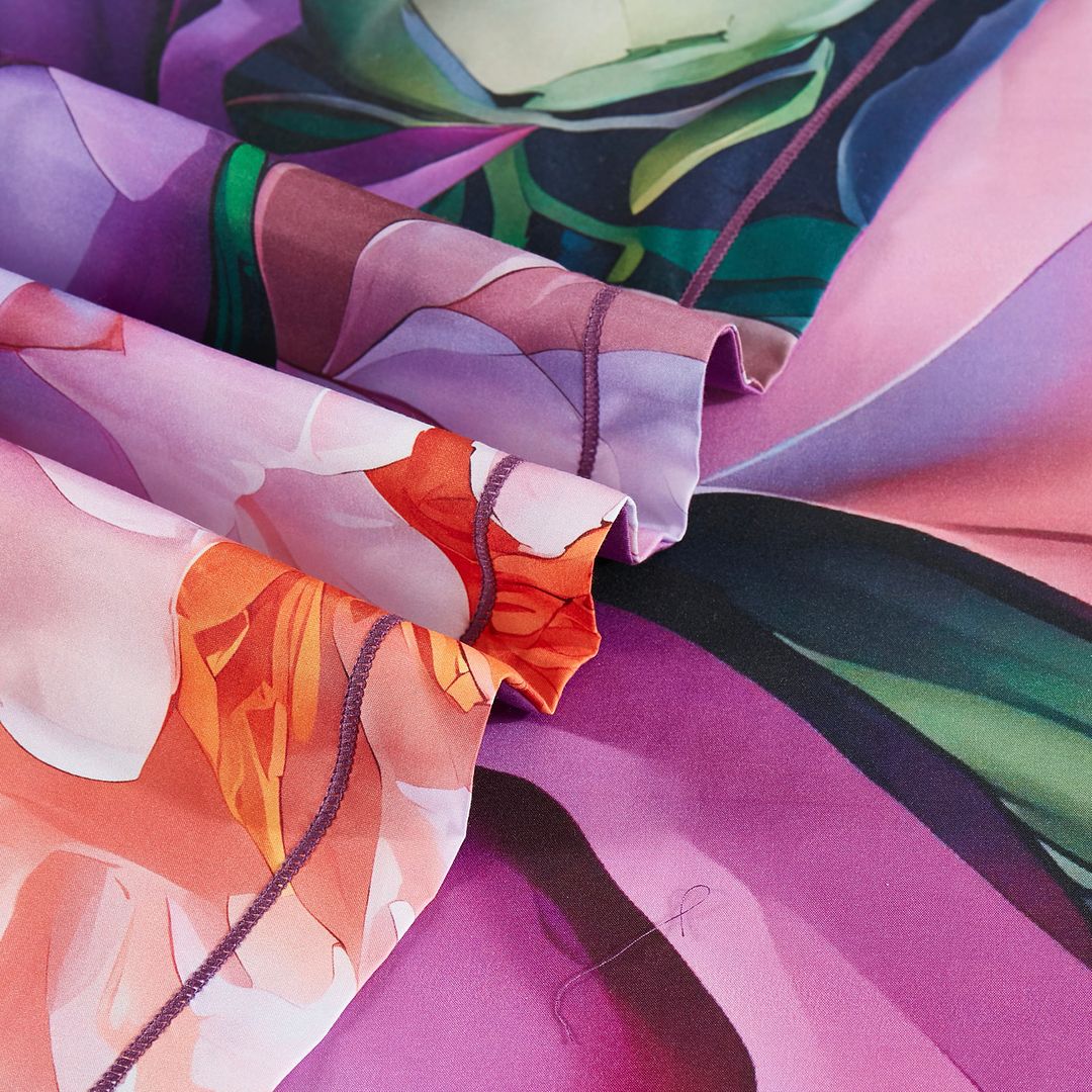 Close-up of vibrant floral fabric detail from the Kaie Floral Quilt Cover Set - Super King Size by Bedzy