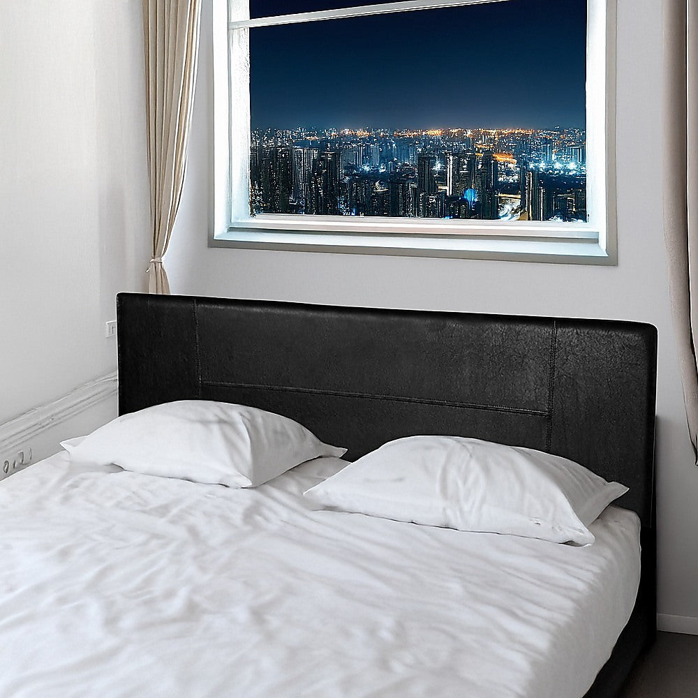 King Size | PU Leather Bed Headboard (Black) with sleek stitching in a modern bedroom setting by a large window