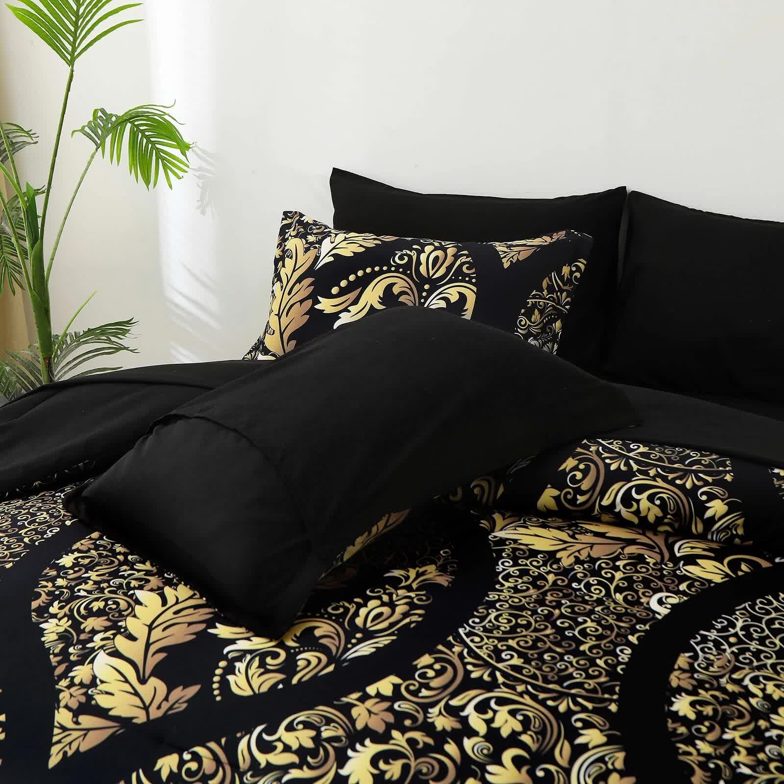 Regal Elegance Black and Gold 3 Pc Comforter & Pillow Cover Set KING with intricate baroque pattern and solid black pillowcases displayed on bed