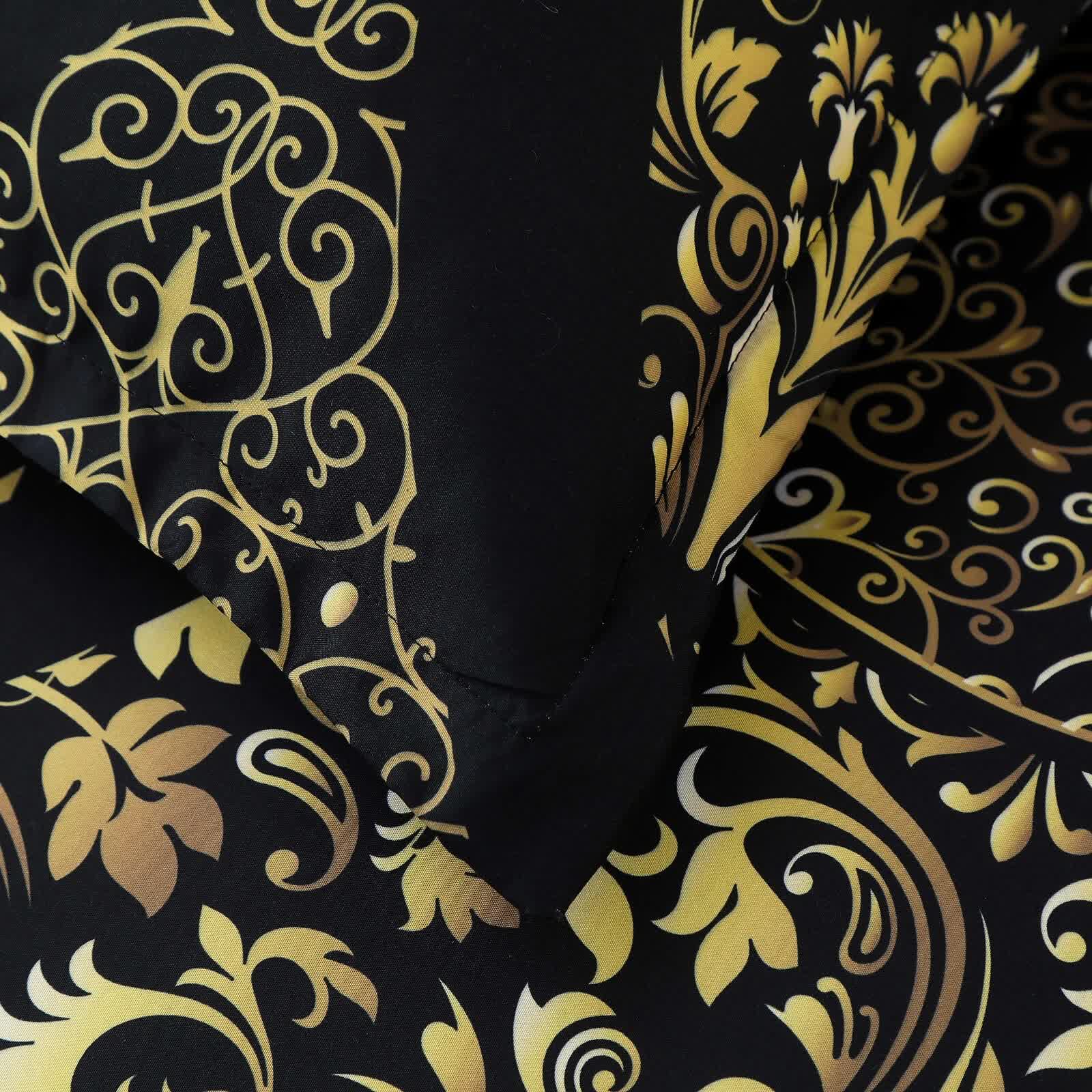 Close-up of Regal Elegance Black and Gold 3 Pc Comforter & Pillow Cover Set KING featuring gold ornate pattern on black fabric.