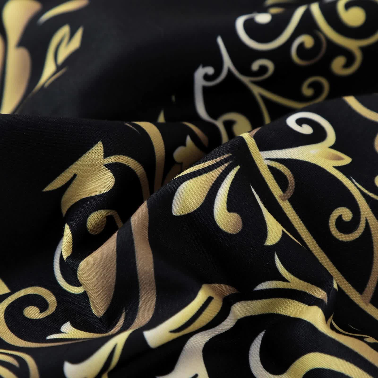 Regal Elegance Black and Gold 3 Pc Comforter & Pillow Cover Set KING with intricate gold patterns on black fabric close-up view
