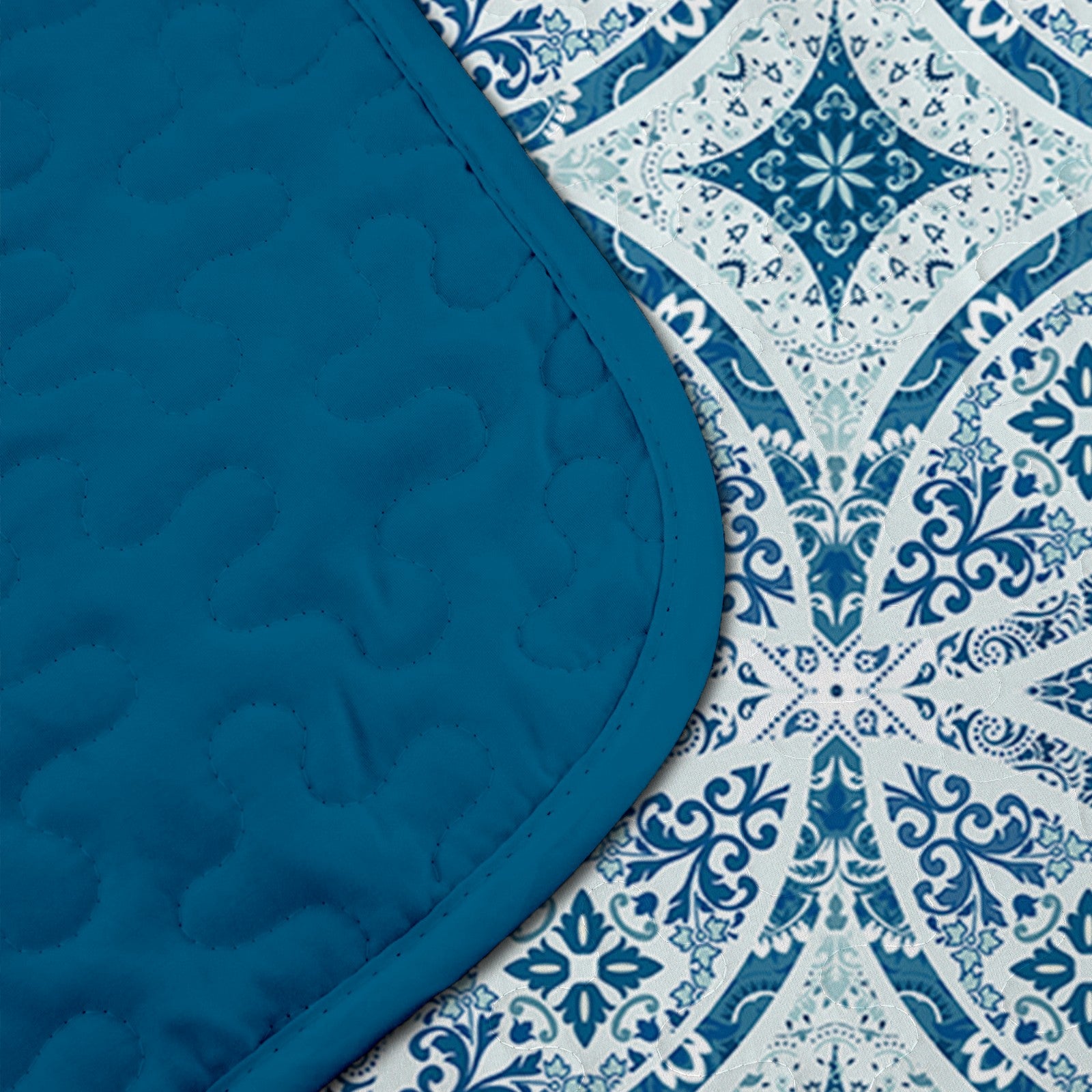 Close-up of reversible quilt showing solid teal and intricate patterned sides of Whimsical Winter Frosty Elegant 3 Pc Bedspread & Pillow Cover Set