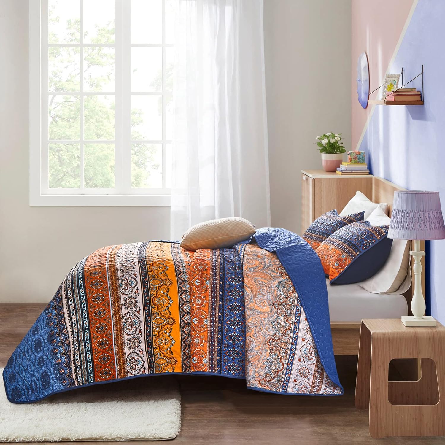 Exquisite Delicate Floral Classic 3 Pc XL Bedspread & Pillow Cover Set with vibrant orange and blue patterns on a bed in a cozy bedroom