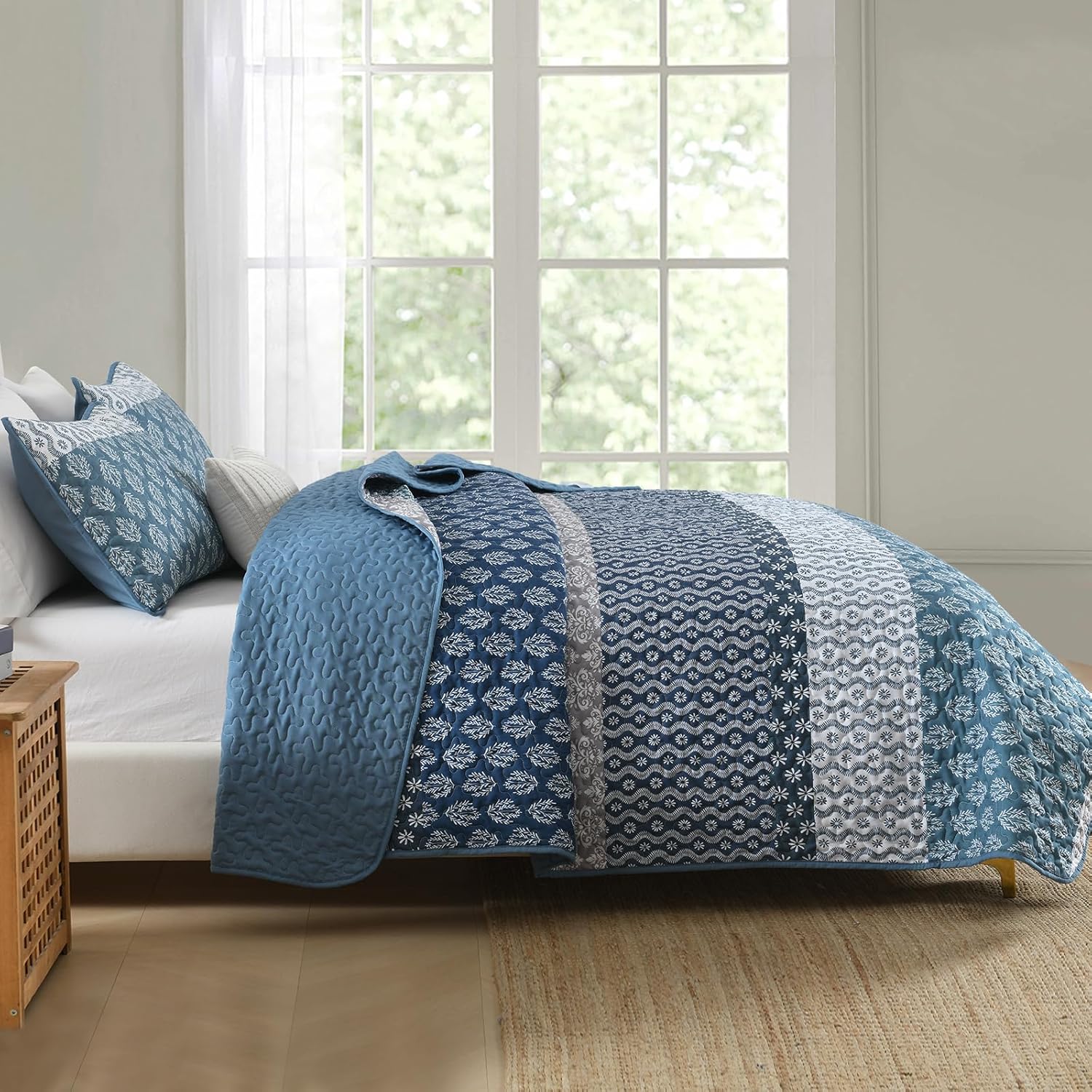 Classic Hydrangea Soft Quilted 3 Pc Bedspread & Pillow Cover Set on bed with blue patterned design in bright bedroom setting