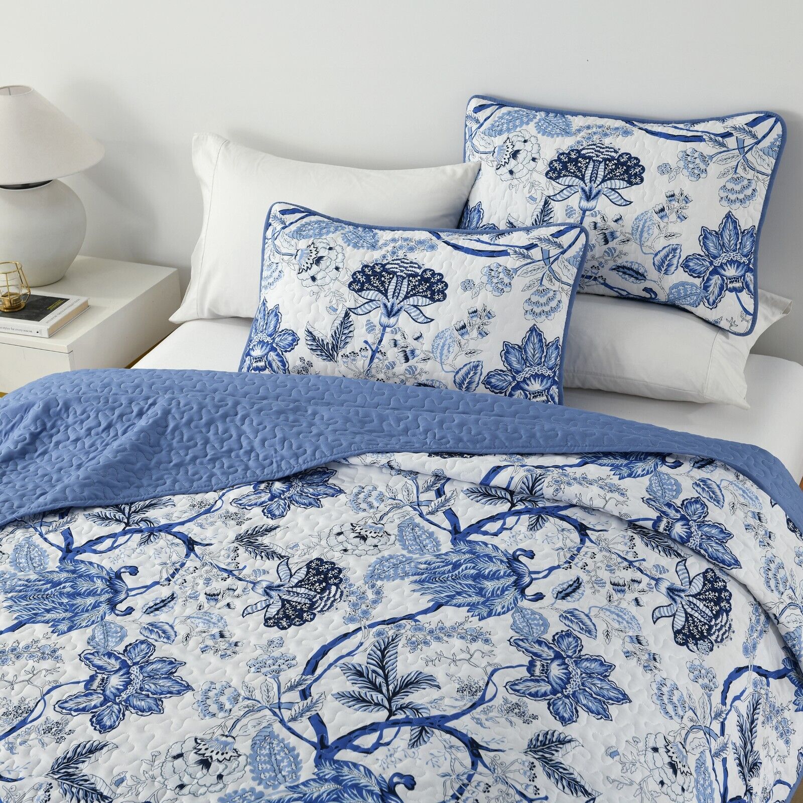 Blossoming Peony Garden blue white 3 Pc Bedspread & Pillow Cover Set with floral pattern on neatly made bed in bedroom furniture setting
