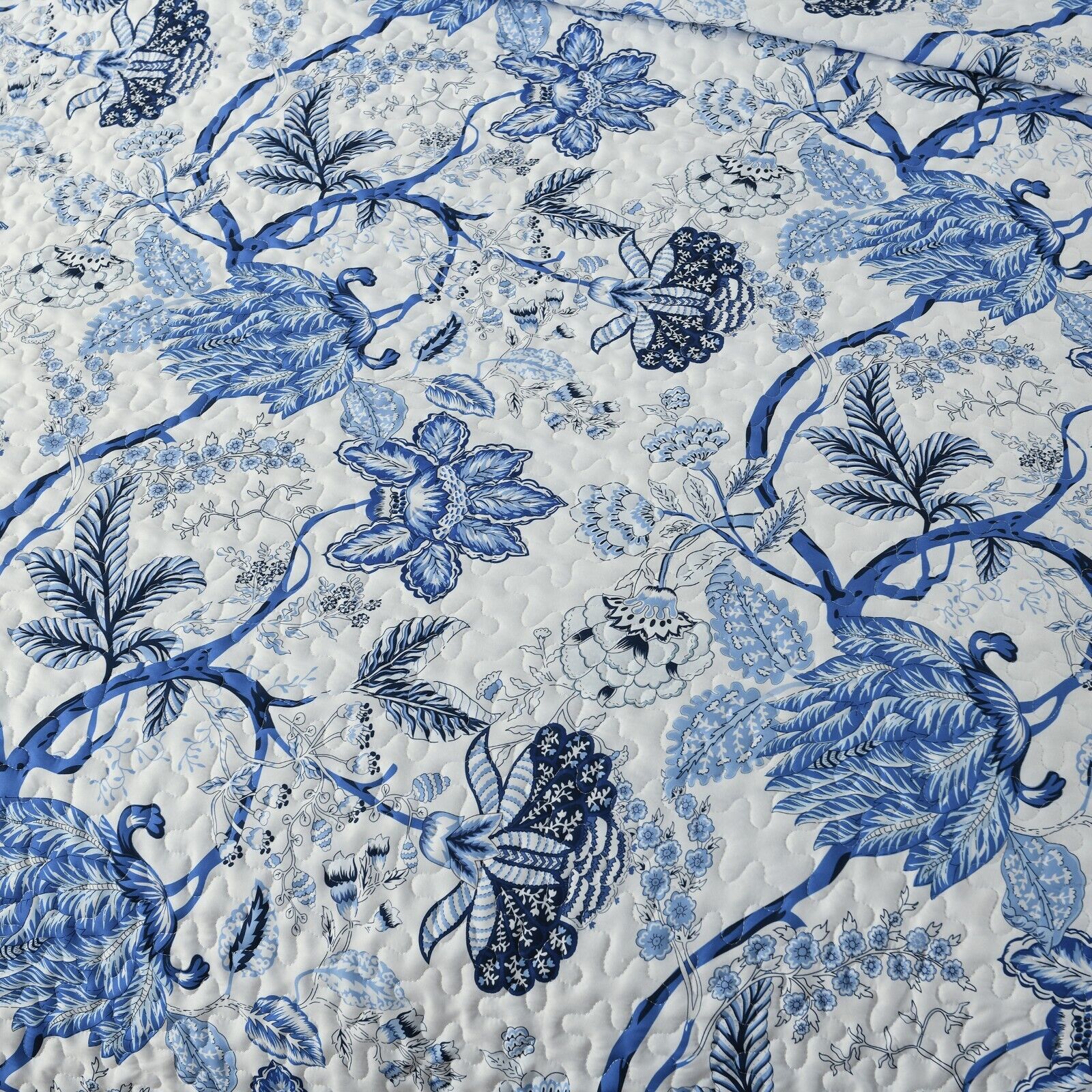 Close-up of Blossoming Peony Garden blue white 3 Pc Bedspread & Pillow Cover Set with floral and peacock pattern on quilted fabric