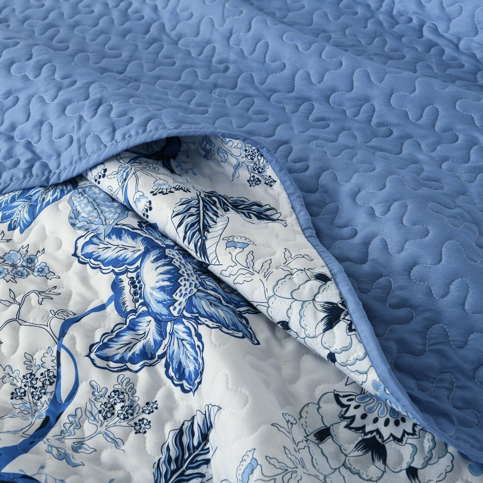 Close-up of Blossoming Peony Garden blue white 3 Pc Bedspread & Pillow Cover Set with blue quilted fabric and floral pattern