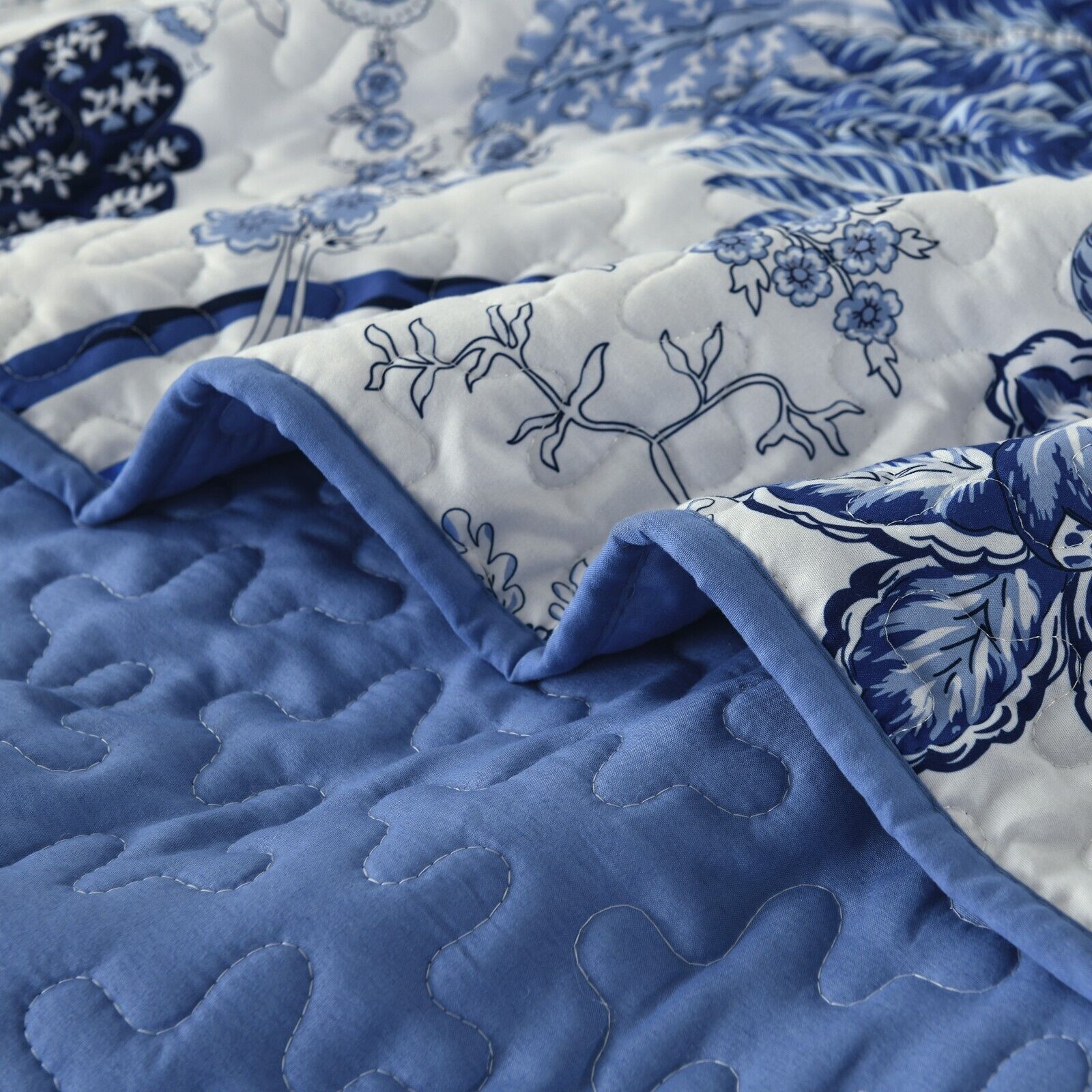 Close-up of Blossoming Peony Garden blue white 3 Pc Bedspread & Pillow Cover Set showing floral pattern and quilted stitching details