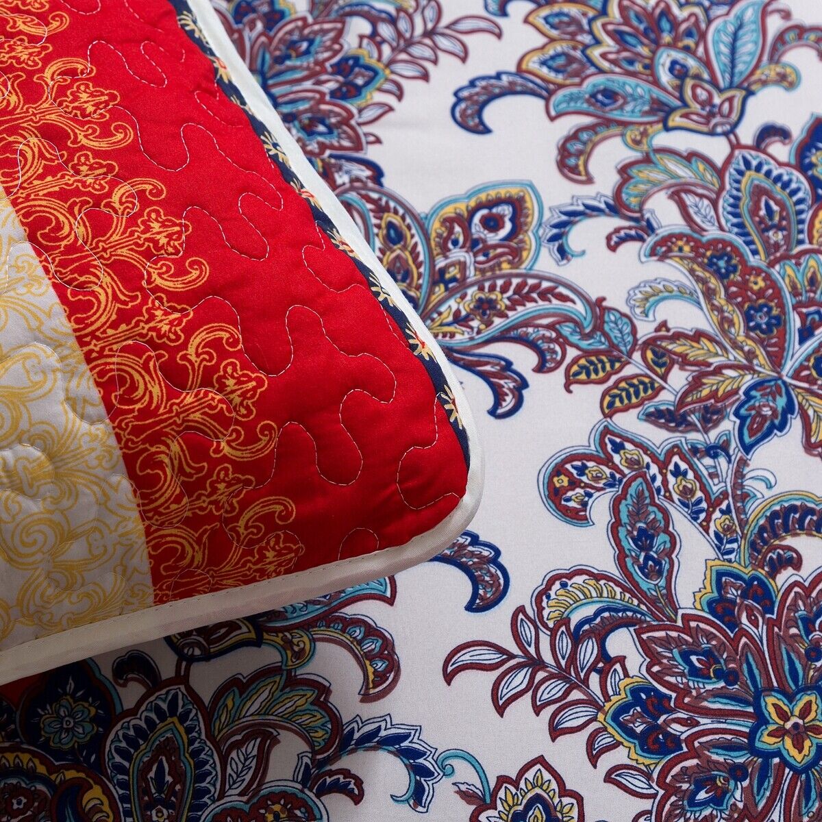 Close-up of Rusty Boho floral Chic 3 Pc Bedspread & Pillow Cover Set with colorful paisley and floral patterns on quilt and pillow.
