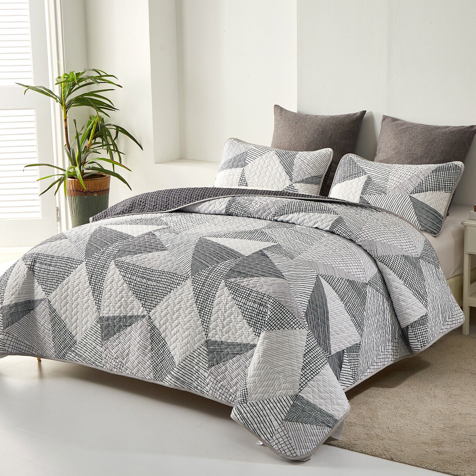 Charming urban pattern 3 Pc Bedspread & Pillow Cover Set with geometric quilt design on queen bed in modern bedroom setting