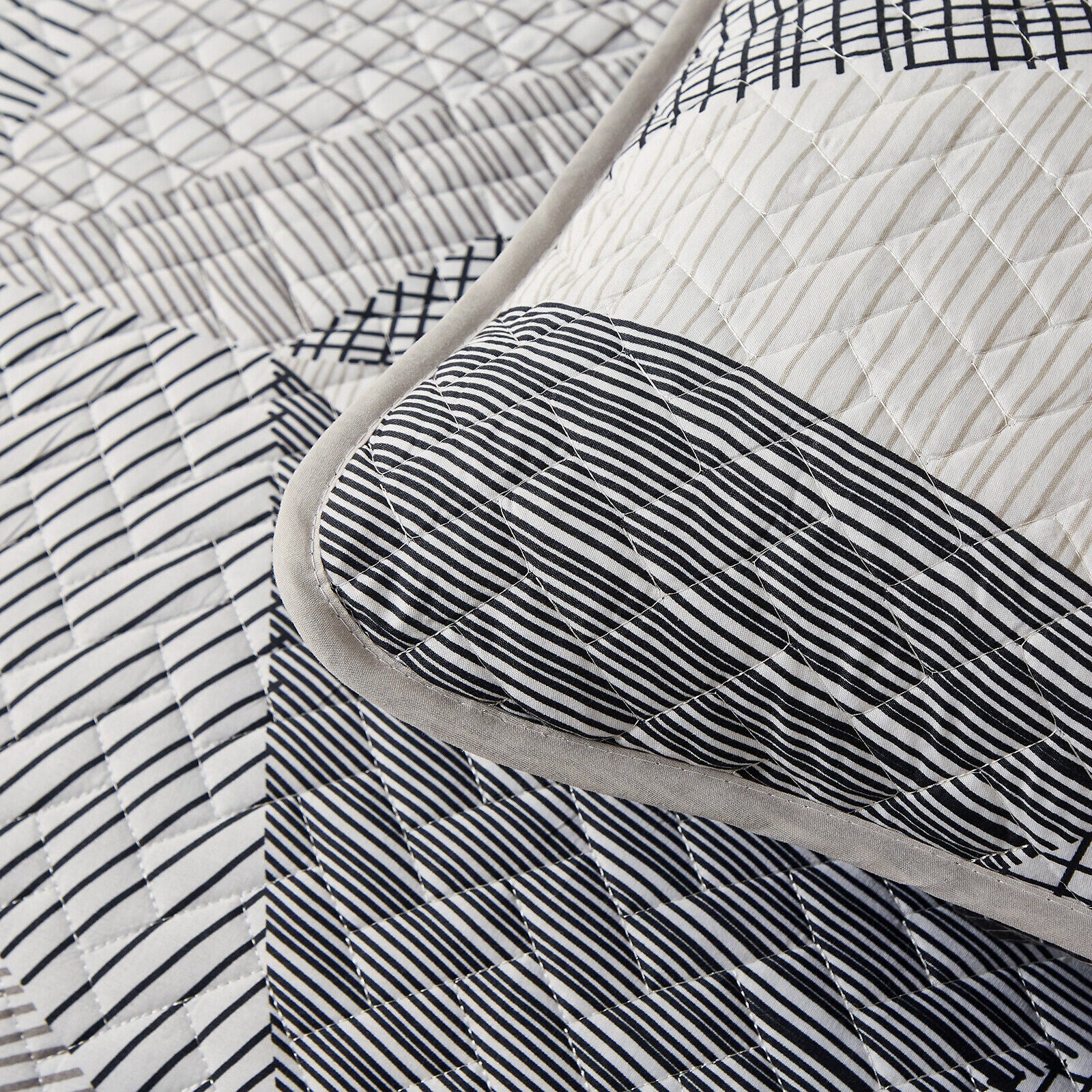 Close-up of Charming urban pattern 3 Pc Bedspread & Pillow Cover Set with black and white geometric quilted design