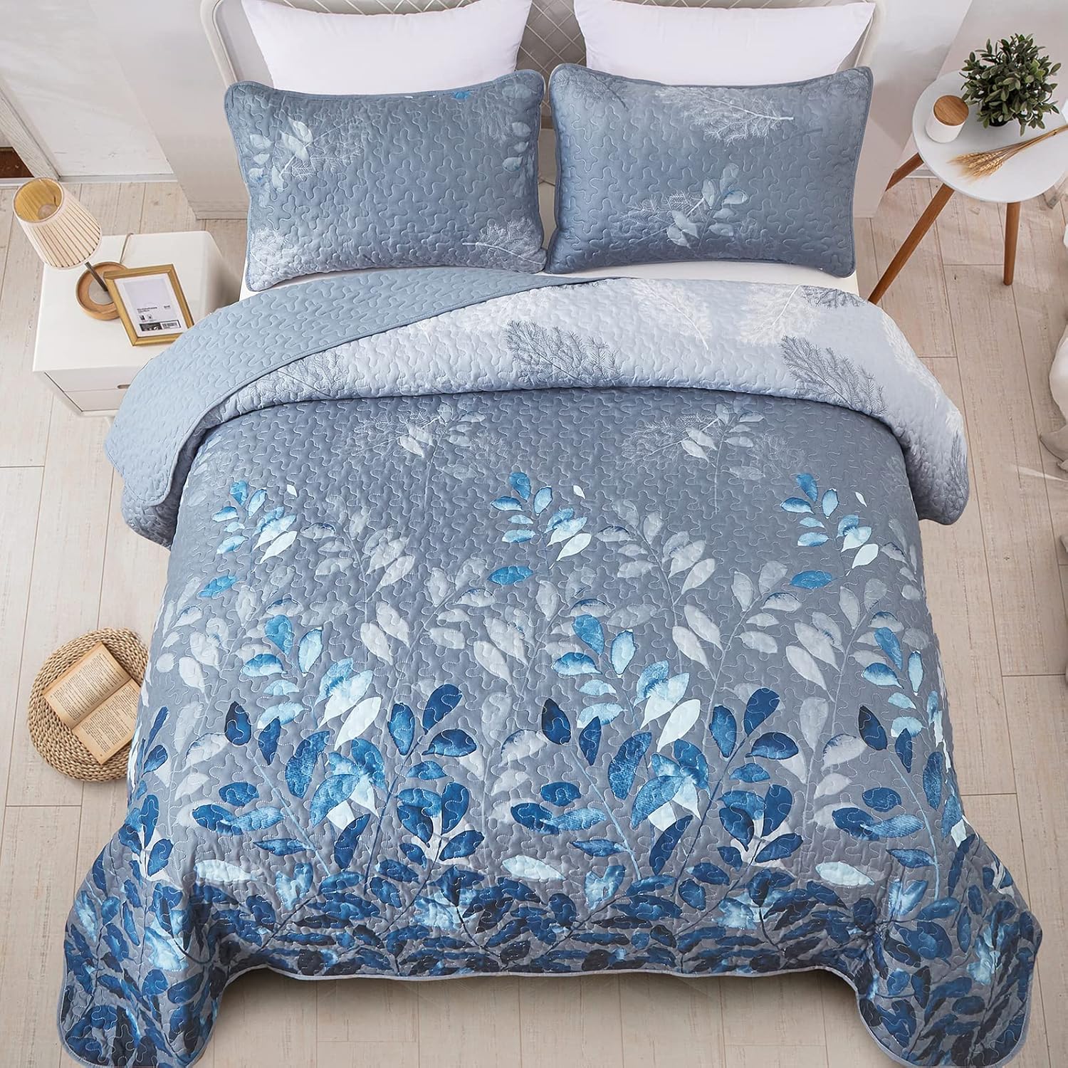 Tranquil Zen Garden Floral 3 Pc Bedspread & Pillow Cover Set with blue floral quilted design on bed in bedroom setting