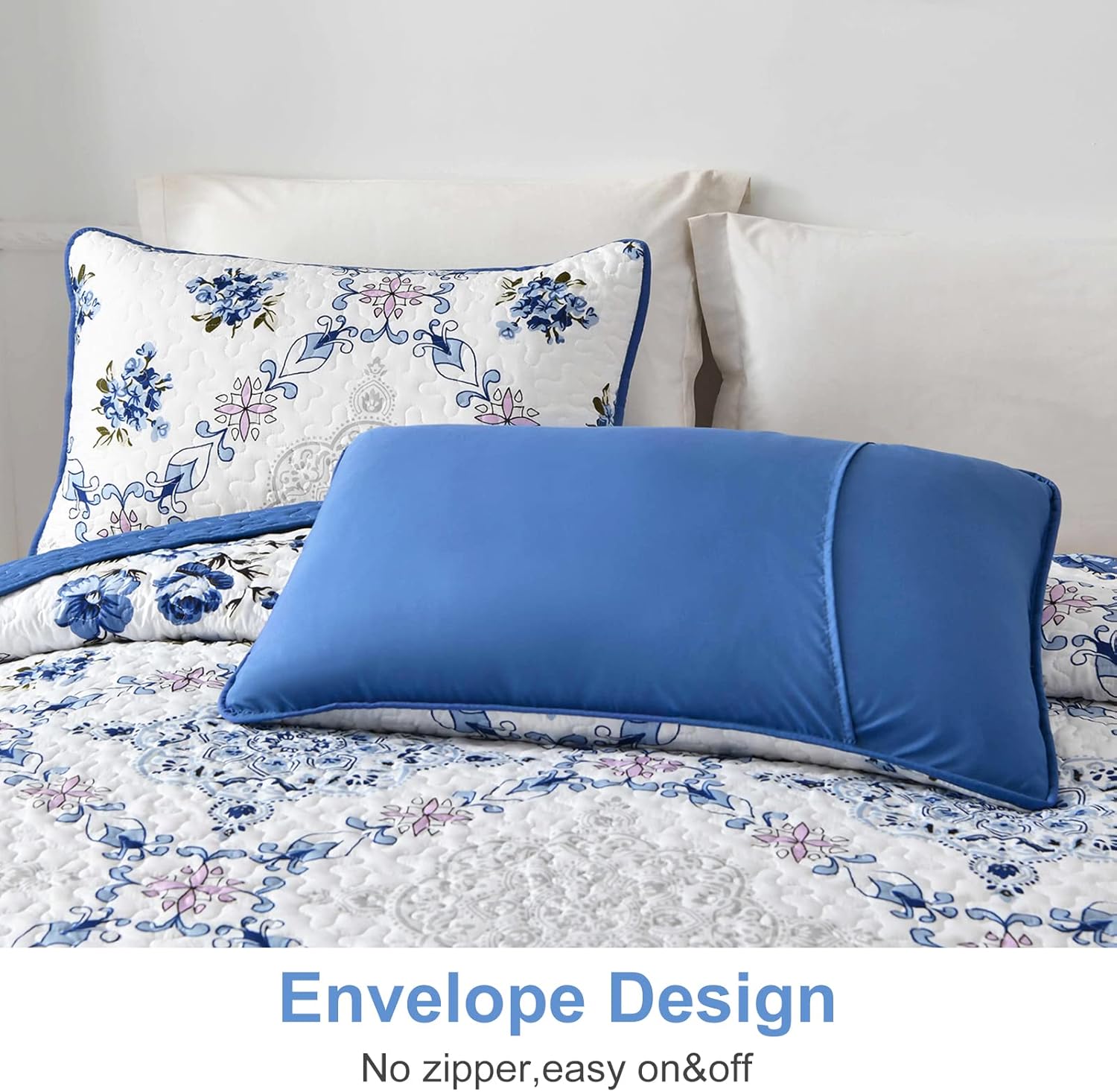 Rich white blue Elegant 3 Pc Bedspread & Pillow Cover Set featuring floral pattern and solid blue pillow on a made bed