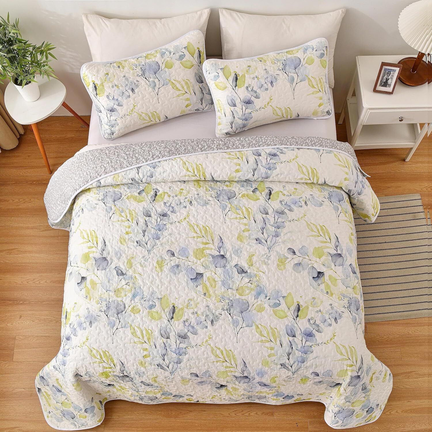 Regal Orchid Bloom 3 Pc Bedspread & Pillow Cover Set with floral quilt and matching pillow covers on queen bed