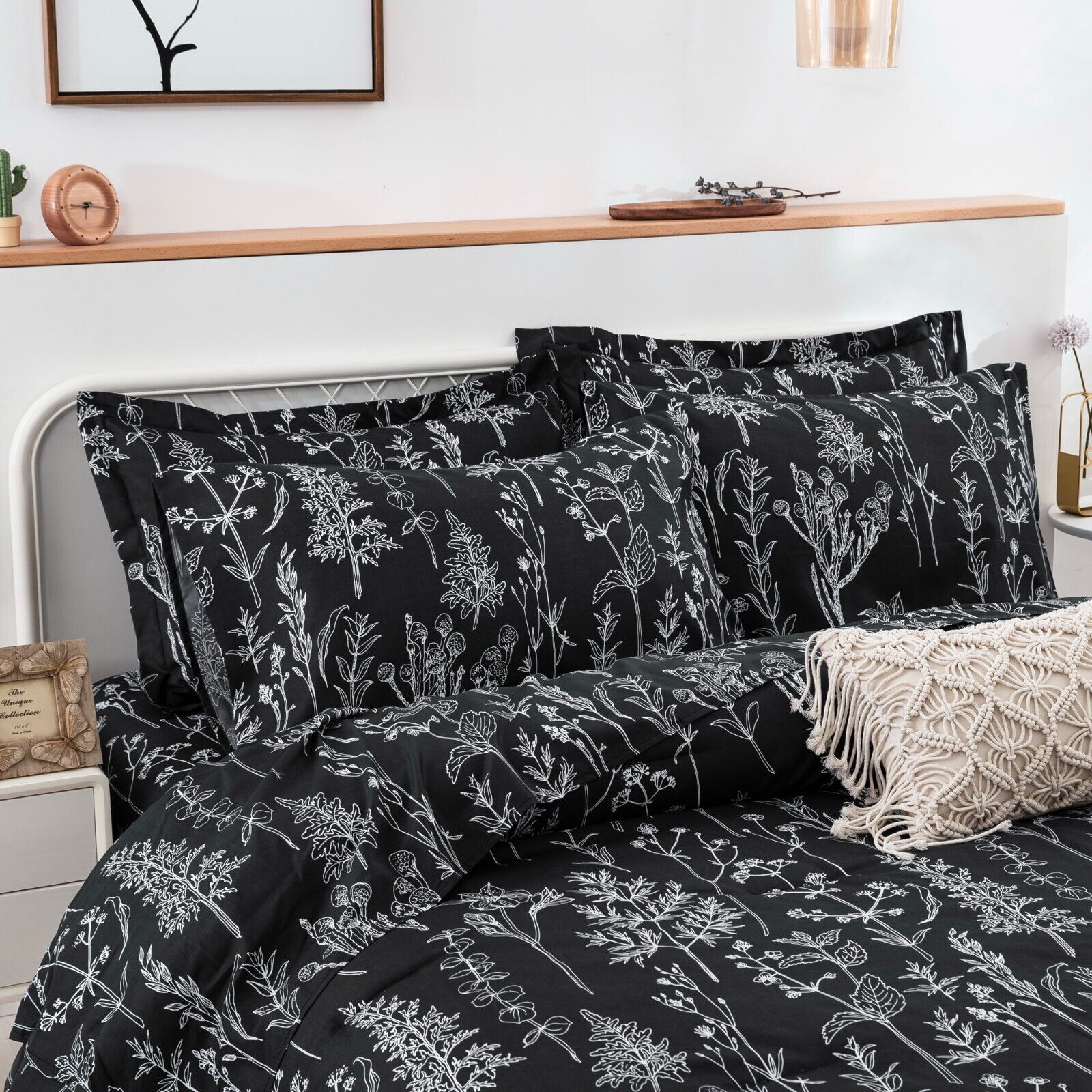 Floral Leaves Comforter Set, Queen Size, Microfiber Quilted Bedding with Pillowcase in black with white botanical print on bed