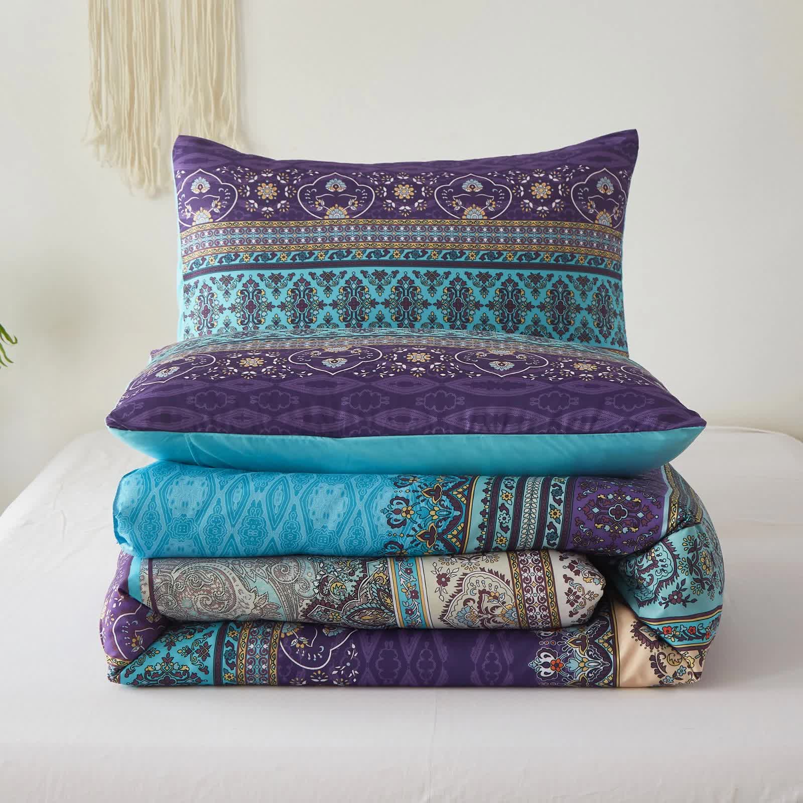 Boho Glow Teal Bedding – 3‑Piece Comforter Set for Relaxed Spaces folded with intricate teal and purple patterns on white bed background