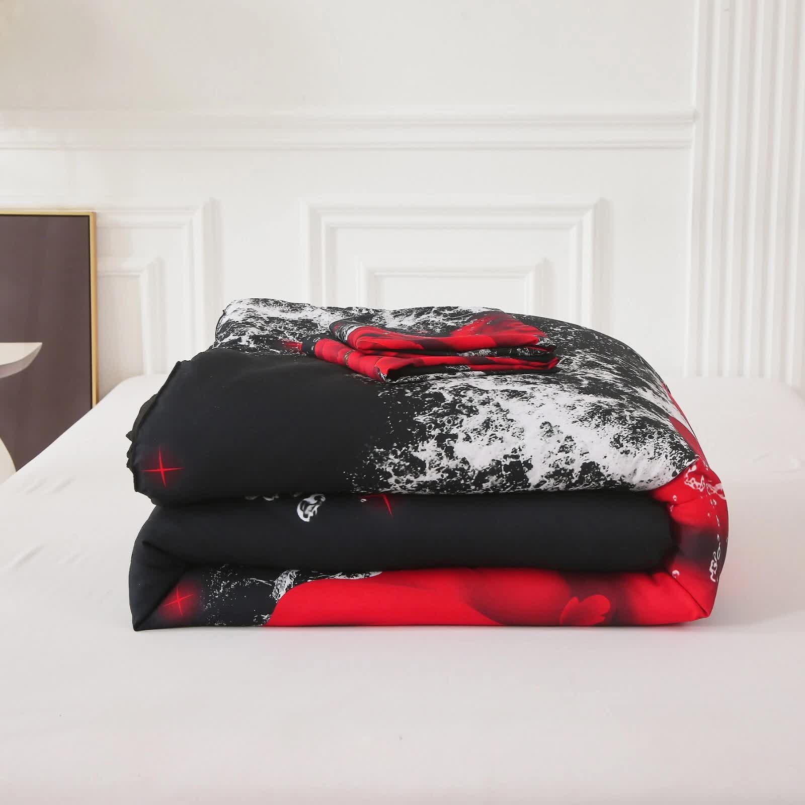 Folded Chill Haven Red Rose 3‑Piece Comforter Bundle – Relax & Recharge Style with red, black, and white pattern on bed
